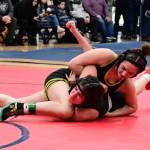 Kyla Scheff (on top) wrestles on the mat. (Tony Puz photo)