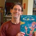 Islander Bill Jarcho, with his latest childrens book. (Courtesy photo)