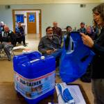 EOC volunteer Michelle Bates showed off several home emergency water essentials to the EOC drill night participants. Useful items included storage containers and water purification filters. (Courtesy photo)