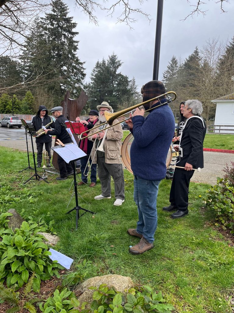 The VasHonK Community Street Band joined the Mar. 21 Vashon Nature Center work party at Heron Meadow, just east of the Vashon Center For The Arts. (Bianca Perla photo)