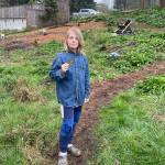 Maverick Wilkes, 11, holds a patch from the Nature Center after helping at the March 21 Heron Meadow work party. (Mari Kanagy photo)