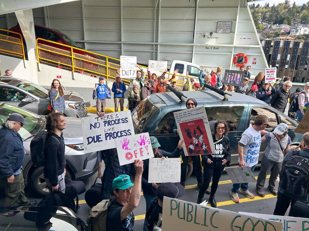 Christy Clement photo
A throng of islanders boarded the ferry to Fauntleroy to join a Hands Off! protest at the Seattle Center on Saturday, April 5.