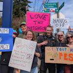 Ina Gylys-Colwell photo
A King County sheriffs deputy, who helped tamp down tensions at one point as a person argued with protestors, is pictured at the protest Saturday.