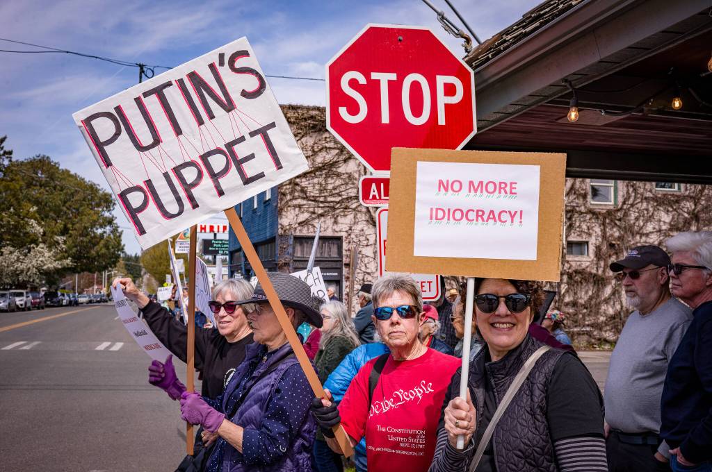 Kent Phelan photo
Signs at the demonstration read PUTINS PUPPET and NO MORE IDIOCRACY!