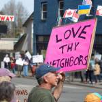 Alex Bruell photo
A sign affixed with the flags of other countries reads LOVE THY NEIGHBORS at the demonstration.