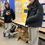 (Left to right) Oskar Salem, Desmond Berg, and Levi Cobb show off Project Goldberg. (Elizabeth Shepherd photo)