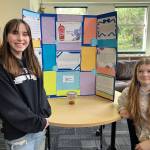 McMurray students (left) Sylvia Collins and Maddie Brittenham investigated the different properties that boba  also known as tapioca pearls  took on when dropped into a variety of beverages. (Elizabeth Shepherd photo)