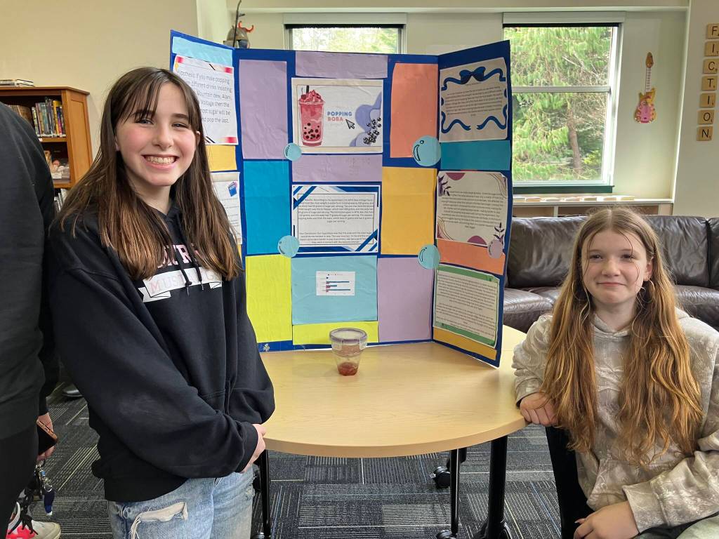 McMurray students (left) Sylvia Collins and Maddie Brittenham investigated the different properties that boba  also known as tapioca pearls  took on when dropped into a variety of beverages. (Elizabeth Shepherd photo)