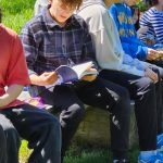Maxwell Woodget checks out the newly published book Minor Poetry. (Courtesy photo)