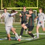 Pirate forward Mason Haynes takes on Cougar defender Maddox Miller. (Dawn Stief photo