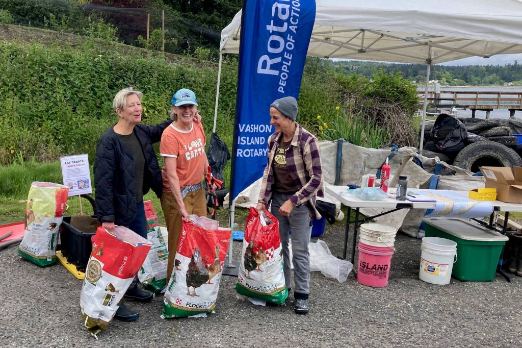 Volunteers Leslie Mackie, Corinne Kerr and Teri Smith return from Maury Island with their haul. (Courtesy photo)