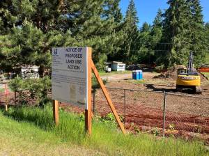 Last week, land clearing changed the landscape of the future site of Creekside Village, an affordable housing development on Vashon. The mobile homes remaining on the property, seen at left in this photo, have now also been removed. (Elizabeth Shepherd photo)