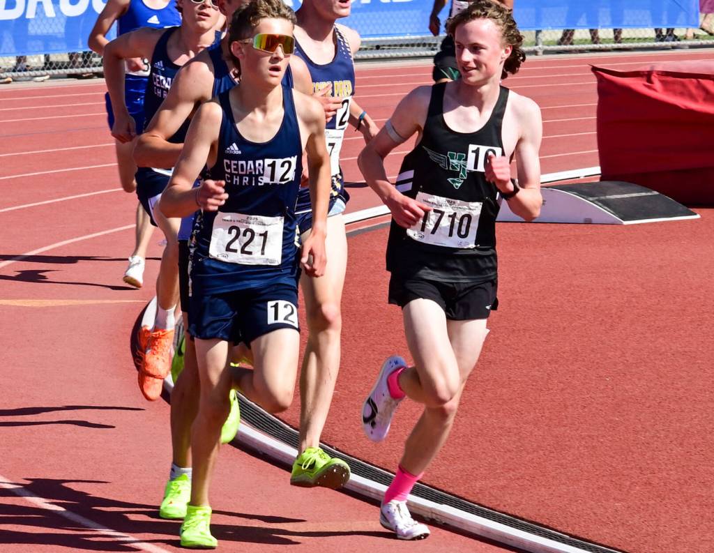 Josh Healey (foreground, right) gave it his all at the end of the 3200 meter run, covering the last 200 meters in around 27 seconds while passing three runners to finish in second place as the state runner-up. (Tony Puz photo)