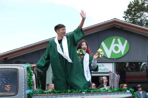 Twin graduates Jamie and Sadie Choo were among those cheered during the 2024 Vashon High School graduation parade. This year, the parade rolls through town from noon to 1 p.m. on Saturday, June 14. (Elizabeth Shepherd file photo)