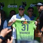 David Warner holds up his jersey for the Seattle Orcas. Ben Ray / The Reporter