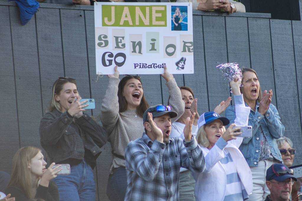 Family and friends holler for graduating seniors. (Alex Bruell photo)
