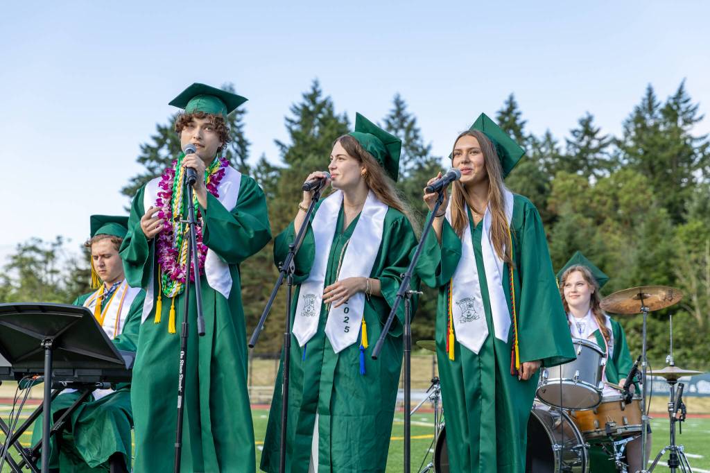 Left to right: Musicians Rowan McBennett, Connor Olsen, Emma Meade, Eva Nelson, and Sloane Overdorf perform Macklemores Good Old Days. (Alex Bruell photo)