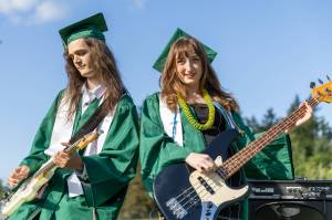 Graduates Zydan Werner and Ellisport Otto watched the sun set during their electric performance of The Chain by Fleetwood Mac. (Alex Bruell photo)