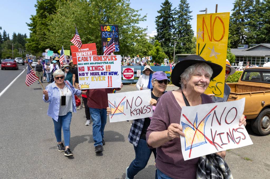 Demonstrators march at the protest on Vashon. (Alex Bruell photo)
