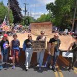 A No Kings protest in Seattle included this large depiction of the U.S. Constitution, crafted by Vashon artists and carried by members of Vashons Backbone Campaign. A similar copy was carried in Los Angeles. (Jim Diers photo)
