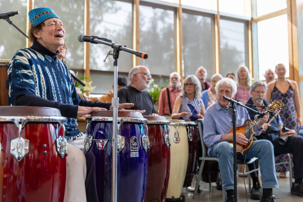 Musician Gordy Ryan led drummers, singers and more musicians in performing African songs of celebration, love and inner strength. (Alex Bruell photo)