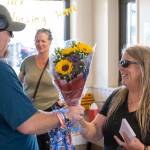 Kimm Shride accepts a bouquet of flowers during her retirement party on Monday, June 30. (Alex Bruell photo)