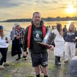 Winner Jake Middling claimed possession of the perpetual trophy for Vashons annual Fourth of July hydroplane race. (Brian Brenno photo)