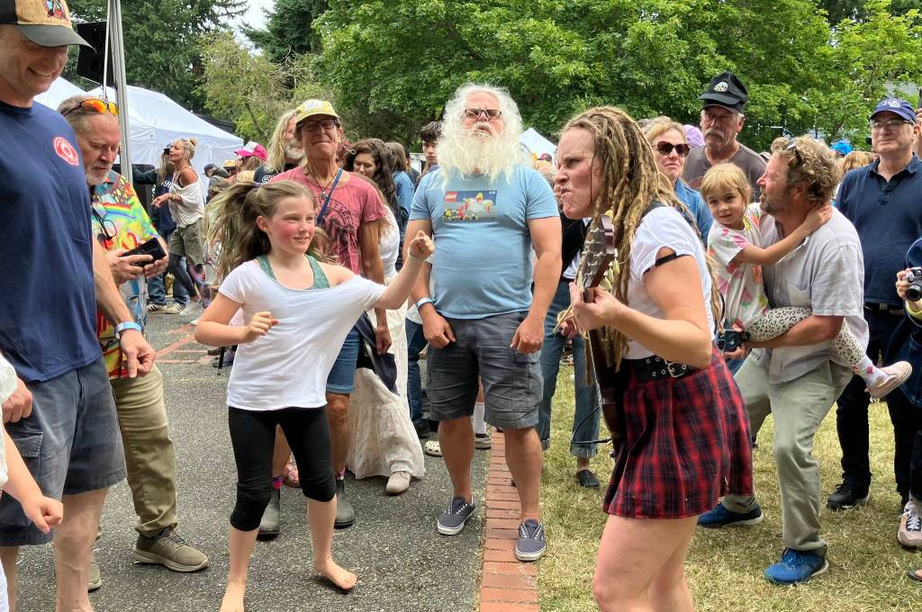 Adrian Conner, the lead guitarist of Hells Bells, an all-female AC/DC cover band, jumped off the Festival Main Stage on Sunday afternoon, to the delight of metal fans both young and old. (Elizabeth Shepherd photo)