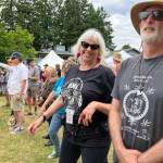 Lynann Politte, a key festival organizer on behalf of Vashon Chamber of Commerce, enjoyed the fruits of her labor at one of the final Main Stage concerts on Sunday with her friend and neighbor, Eliyahu Stahl. (Elizabeth Shepherd photo)