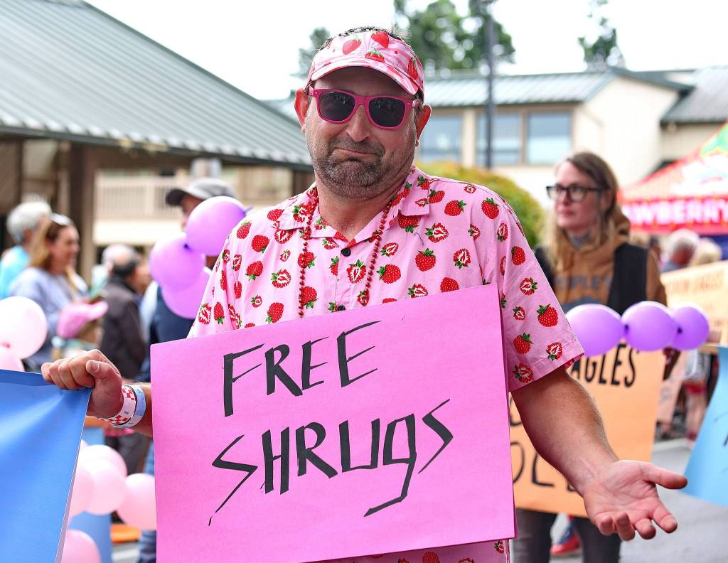 Free shrugs were just one of many quirky sources of entertainment delivered during Festival weekend. (Phil Clapham photo)