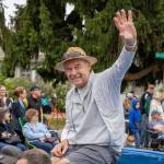 Festival parade Grand Marshal Doug Snyder waves to the crowd from a blue Corvette during the Strawberry Festival parade. (Alex Bruell photo)