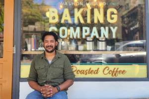 Elijah Berry sits outside Vashon Island Baking Company, the bakery he took over this year. (Phil Clapham photo)