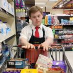 Logan is enjoying his work at Thriftway, meeting new friends and gaining confidence. Courtesy AtWork!