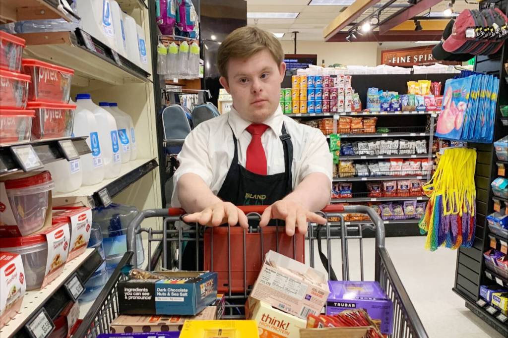 Logan is enjoying his work at Thriftway, meeting new friends and gaining confidence. Courtesy AtWork!