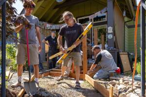 Workers from Meade Building Company work on a ramp at Cynthia and Fred Matuskys Sunflower Community Land Trust home the afternoon of Wednesday, July 30. They finished the final touches on the project on Monday, August 4. (Alex Bruell photo)