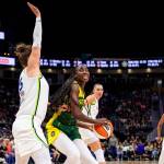 Seattle Storm Center Ezi Magbegor turns against a Lynx defender. Photo courtesy of Seattle Storm.