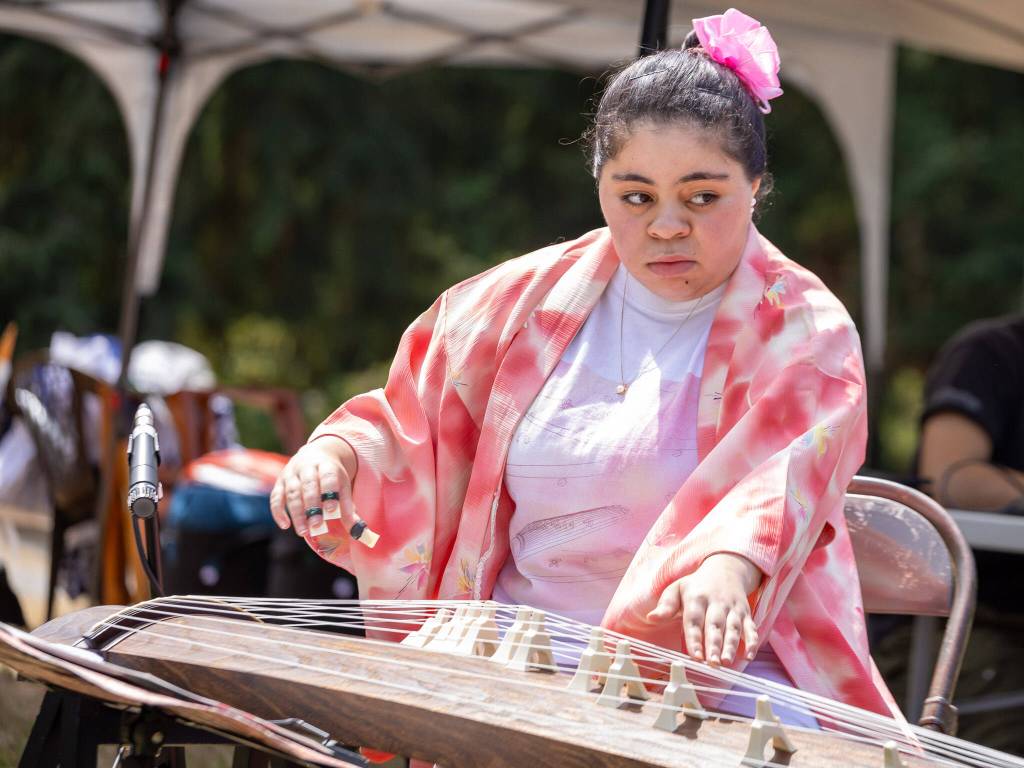 Laryn Young played traditional Japanese koto music during the Kizoku Ishiki Obon celebration. (Alex Bruell photo)