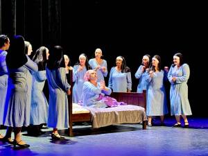 Kiana Kendall (center, on bed), as Deloris in Sister Act, is surrounded by a sisterhood of support and connection. (Kelly Godell Photo)