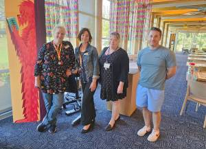 Phil Clapham Photo
Staff members (from left to right) Nita Dickerson, Kate Van Houdt, Mary Sue Houser and Cody Allen welcomed islanders to Vashon Library on Sunday  the librarys first day of seven-day-a-week operations.