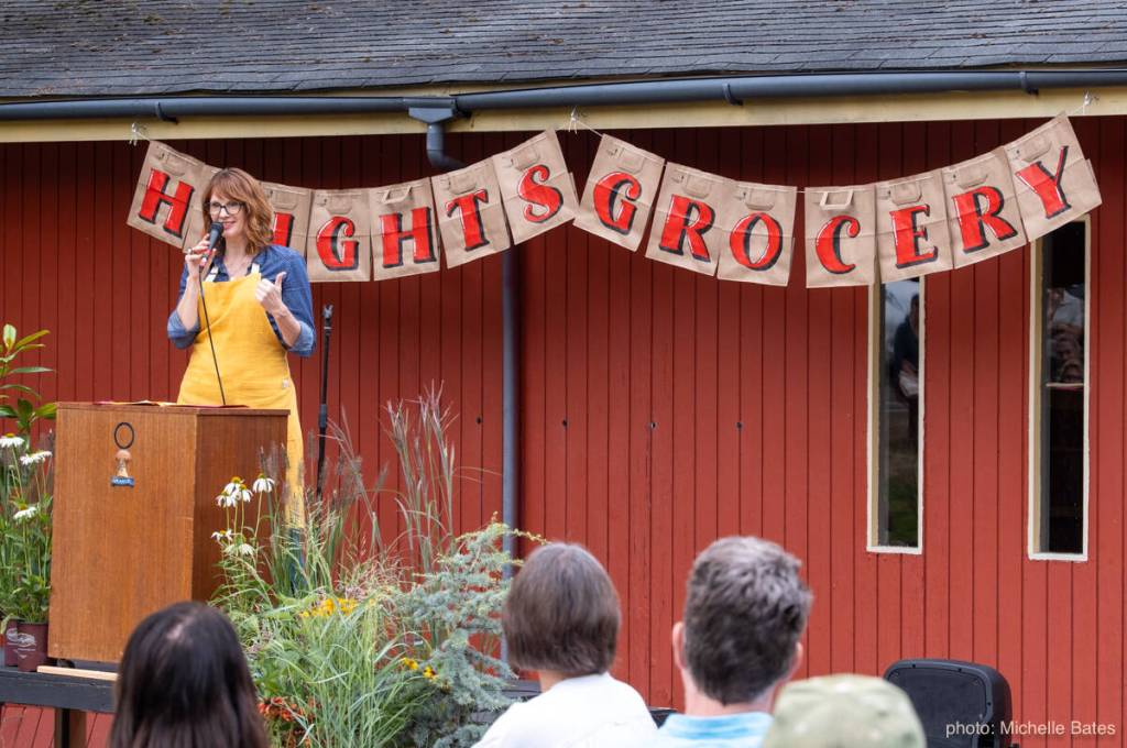 Jennifer Potter welcomes islanders to a celebration of the landmark status of the Vashon-Maury Grange Hall, where she will open a new community grocery store. (Michelle Bates Photo)