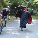 Jim Marsh in his familiar P2P role as the devil, is seen here helping a rider up the tortuous Burma Road. (Jim Diers Photo)