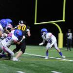 Senior Tallis Sullivan practically carrying three Vikings on his back as he crossed the goal line to score for the Pirates in the homecoming game. (Tom Hughes Photo)
