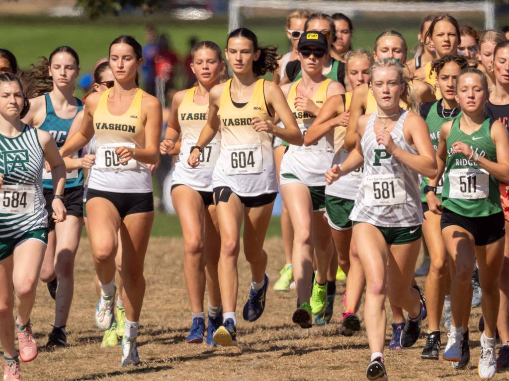 Members of the Vashon High School girls varsity cross country team run during the Fort Steilacoom Invitational in Tacoma. (John Decker Photo)