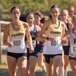 Vashon High School senior captains Cece Guenther and Emily Harrington run in the girls varsity race at the Fort Steilacoom Invitational. (John Decker Photo)