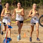 From left, Vashon High School runners Emily Harrington, Cece Guenther and Annabelle Thompson compete in the girls varsity race at the Fort Steilacoom Invitational. (John Decker Photo)