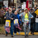Islanders drum and wave signs along Vashon Highway during Saturdays No Kings Day protest. (Kent Phelan Photo)