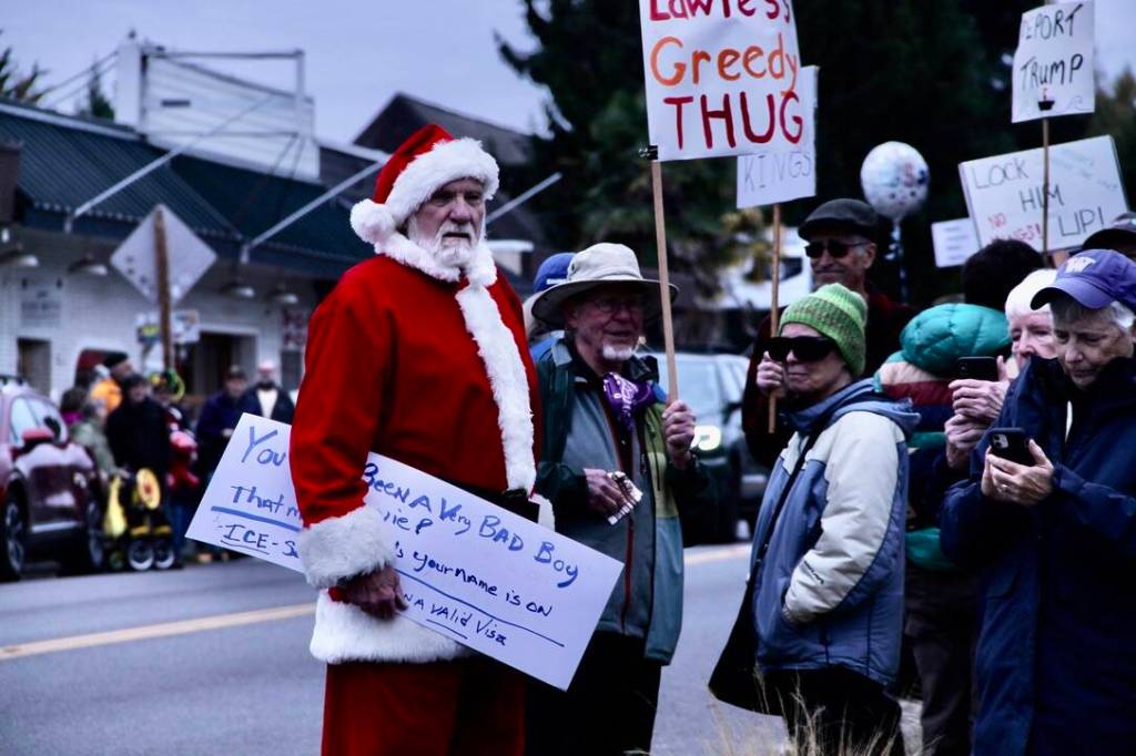 Santa Claus at No Kings protest on Vashon. (Tom Hughes Photo)