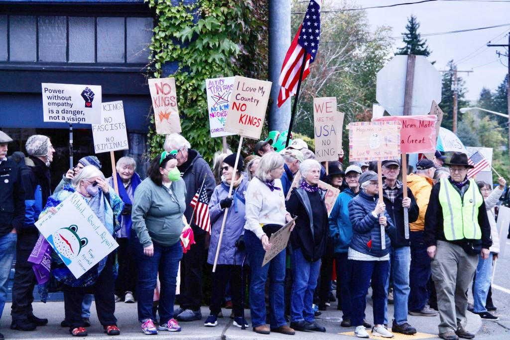 Islanders brought signs, banners, flags, costumes and deep convictions to Vashons No Kings event in the center of Vashon town. (Tom Hughes Photo)