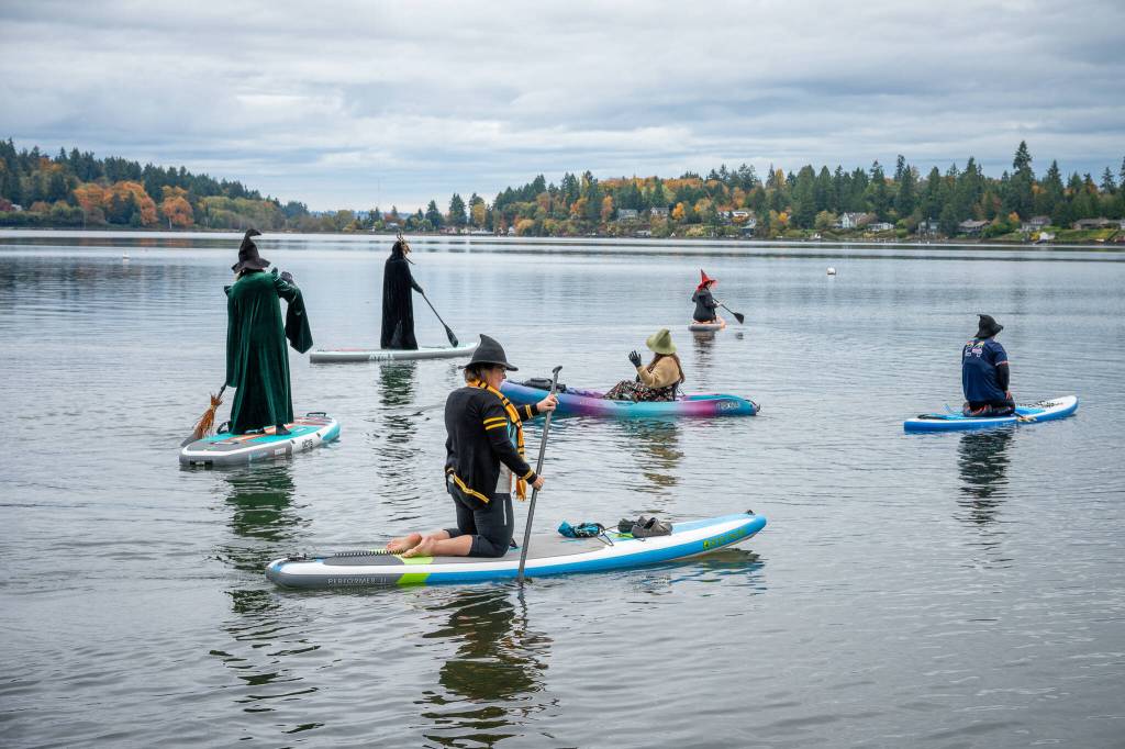 Witches and warlocks launch from Jensen Point, raising funds for the Vashon Teen Council and Vashon Nature Center. (Kent Phelan Photo)
