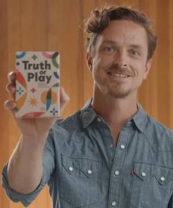 Courtesy Photo
Alex Craighead holds up his new card game, Truth or Play.